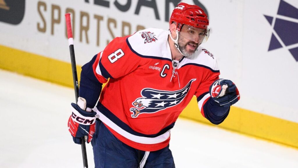 Washington Capitals forward Alex Ovechkin celebrating on the ice after scoring a goal