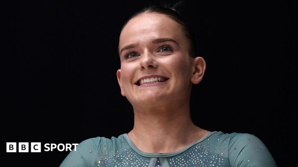 Alice Kinsella competing on the balance beam at the British Artistic Gymnastics Championships