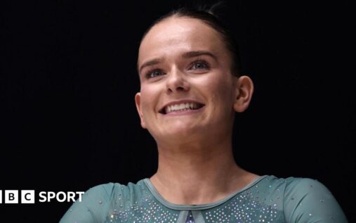 Alice Kinsella competing on the balance beam at the British Artistic Gymnastics Championships