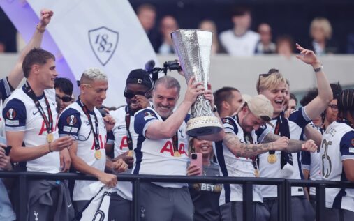 Ange Postecoglou holding the Europa League trophy during the Tottenham Hotspur victory parade