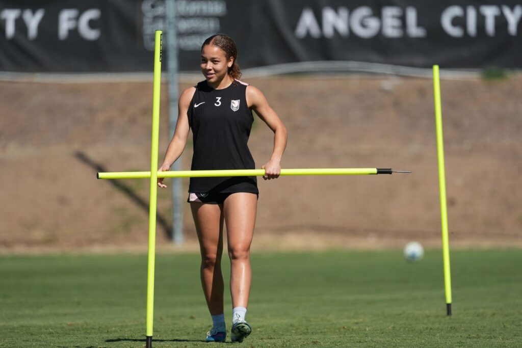 Angel City defender Savy King playing on the pitch in an NWSL match