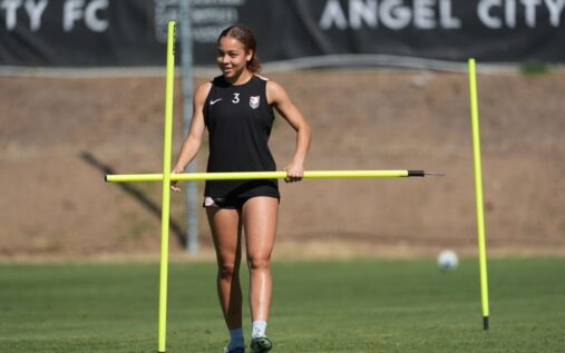 Angel City defender Savy King playing on the pitch in an NWSL match