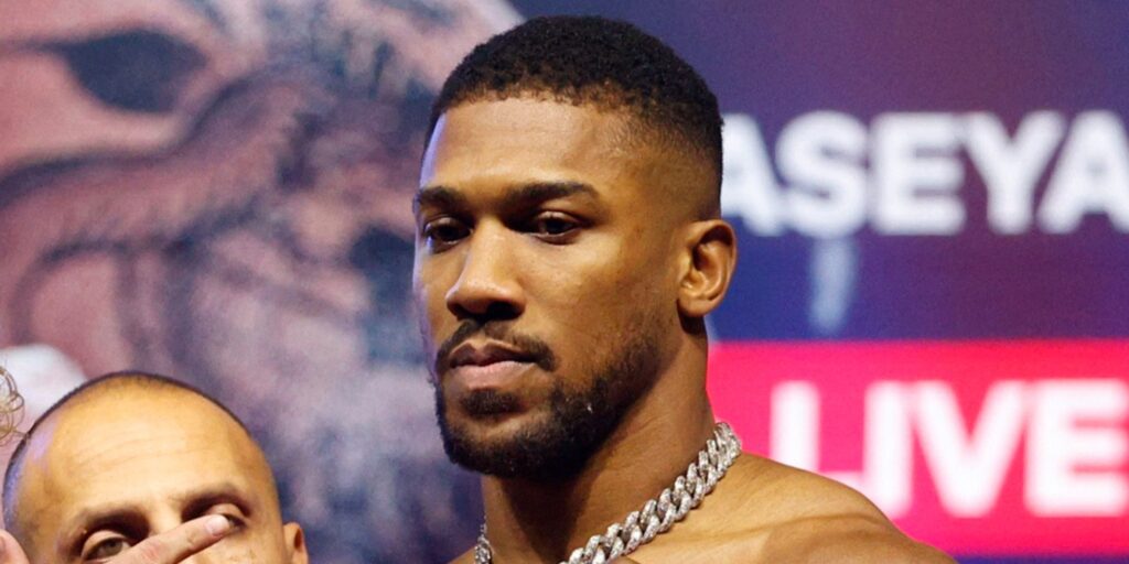 Boxer Anthony Joshua looking serious while standing in the ring
