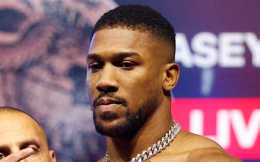Boxer Anthony Joshua looking serious while standing in the ring