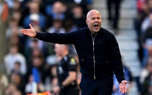 Liverpool manager Arne Slot looking thoughtful on the touchline during a Premier League match