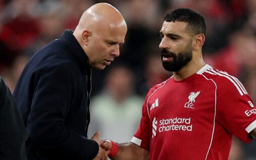 Mohamed Salah and Arne Slot discussing tactics during a Liverpool match