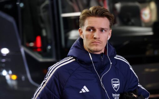 Arsenal captain Martin Odegaard gesturing to teammates during a Premier League match