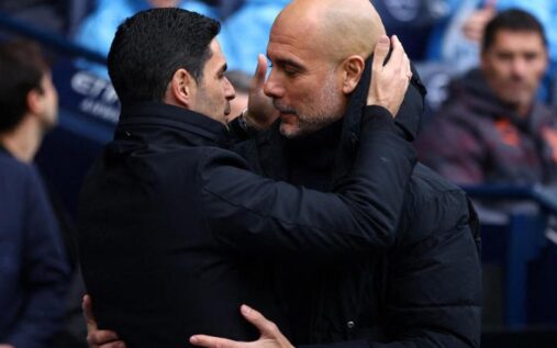 Arsenal and Manchester City players competing in a tense Premier League match