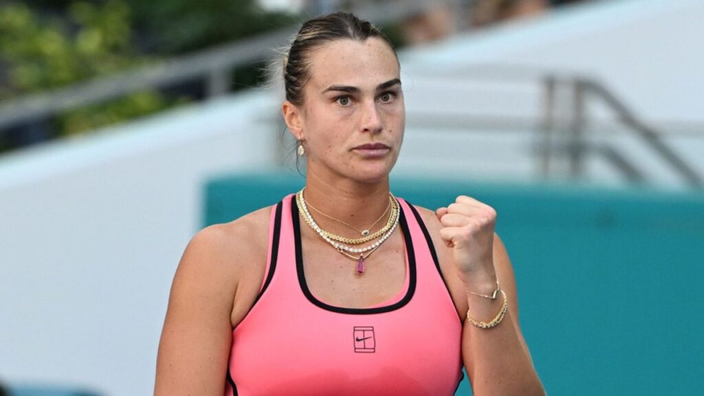 Aryna Sabalenka lifting the Miami Open trophy after defeating Coco Gauff