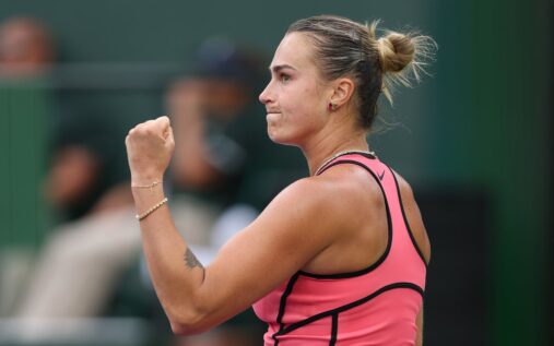 Aryna Sabalenka hitting a powerful serve during an Indian Wells match