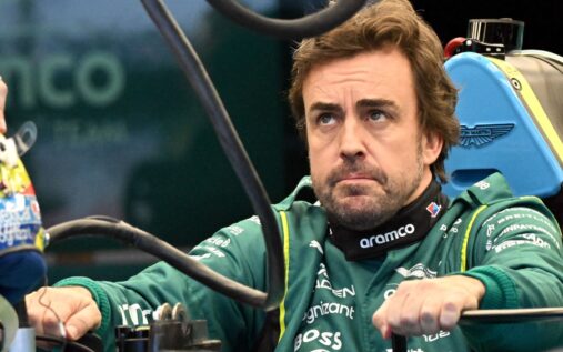 Aston Martin technical chief Adrian Newey looking concerned in the team garage