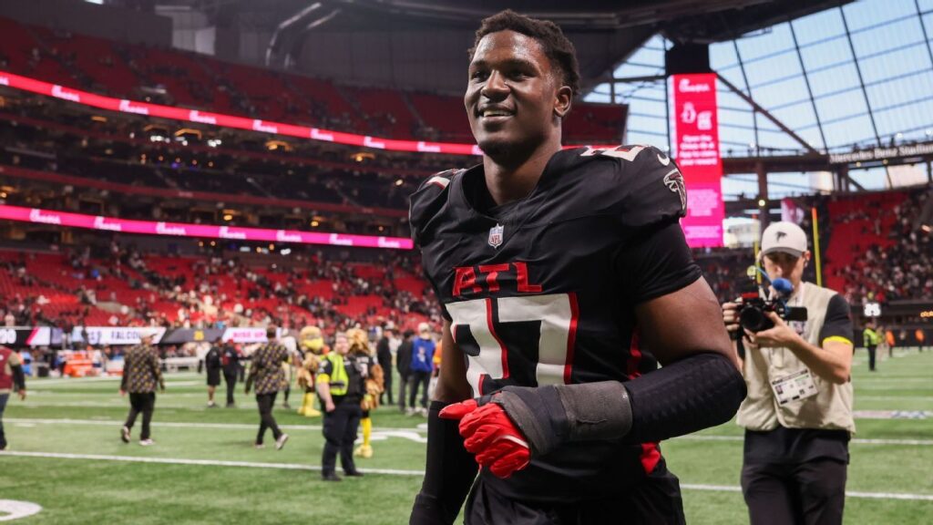 James Pearce Jr of the Atlanta Falcons walking on the field in uniform