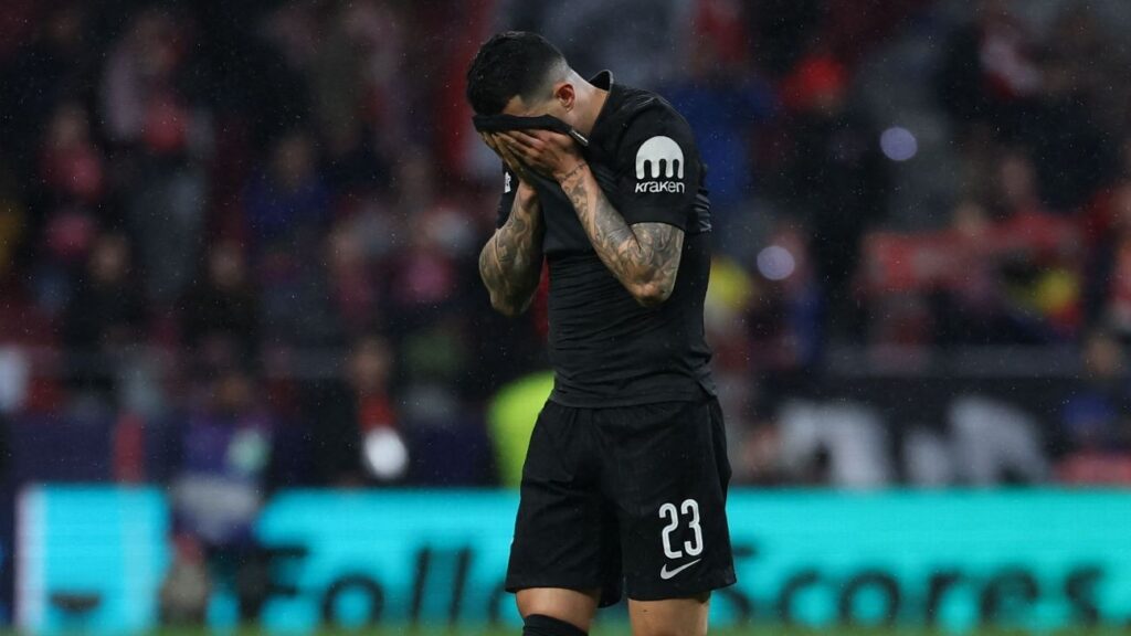Dejected Tottenham Hotspur players react during their heavy Champions League defeat to Atletico Madrid