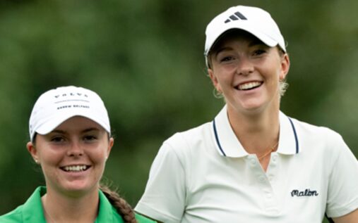 Female amateur golfer hitting an approach shot on the fairway at Augusta National