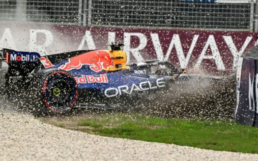 Max Verstappen walking away from his damaged Red Bull car in the gravel trap at the Australian Grand Prix
