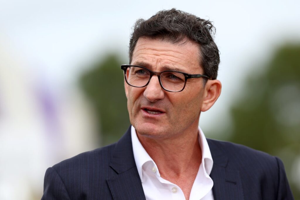 Formula 1 cars racing around the Albert Park circuit in Melbourne during a practice session