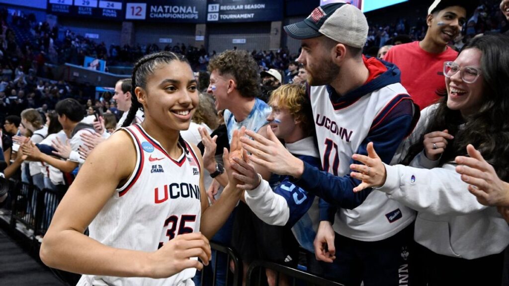 UConn Huskies guard Azzi Fudd shooting a basketball during the NCAA tournament match against Syracuse