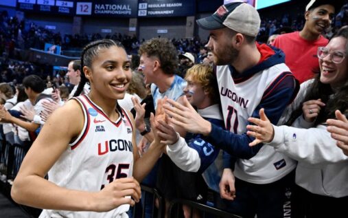UConn Huskies guard Azzi Fudd shooting a basketball during the NCAA tournament match against Syracuse