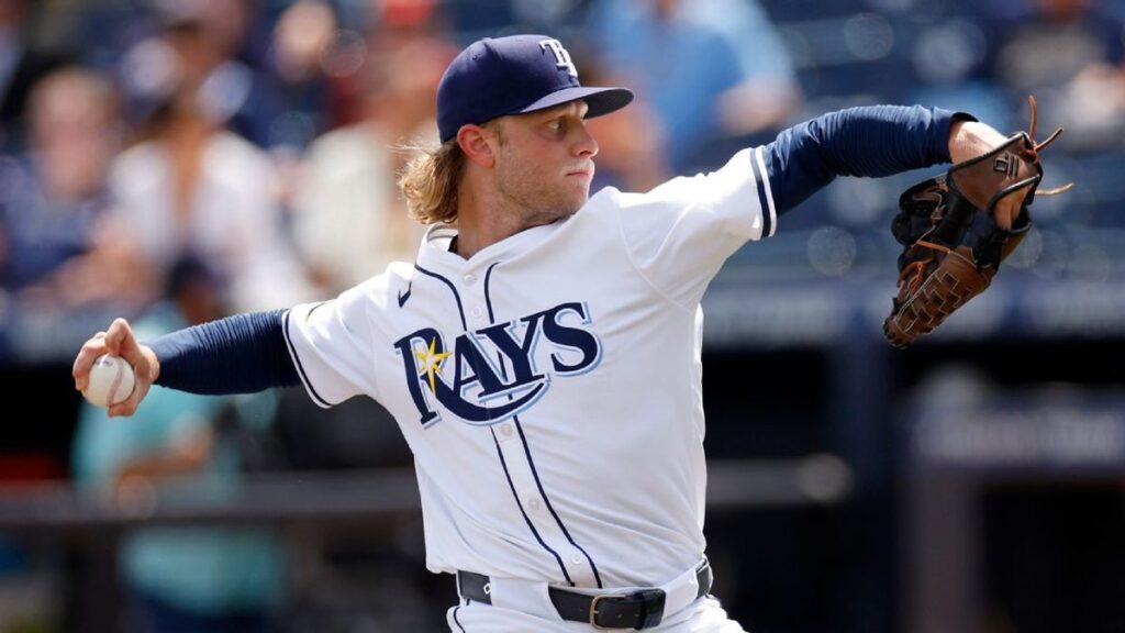 Shane Baz pitching in a Baltimore Orioles uniform during a baseball game