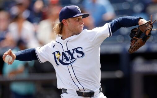 Shane Baz pitching in a Baltimore Orioles uniform during a baseball game