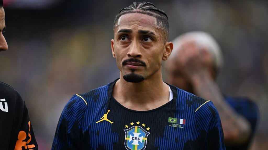 Barcelona forward Raphinha appearing dejected on the pitch