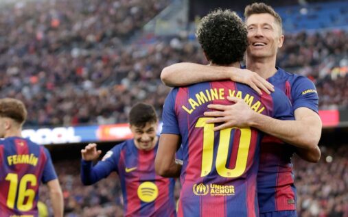 Barcelona manager Hansi Flick gesturing to his players from the touchline during a match