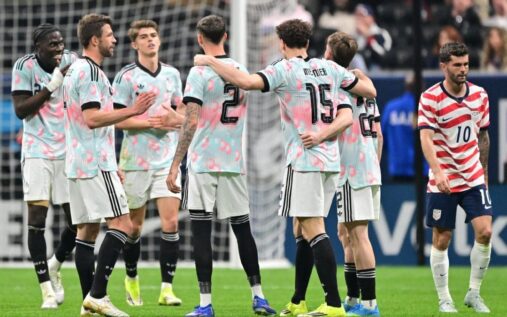 Belgium players celebrating a goal against the United States at Mercedes-Benz Stadium