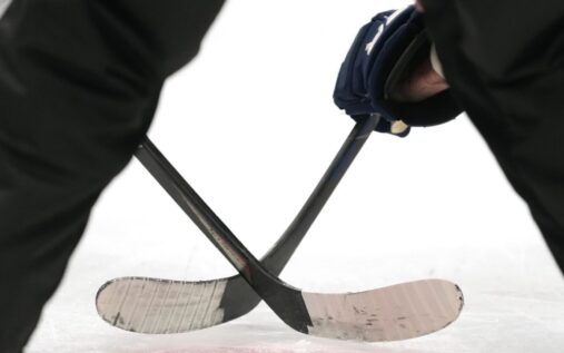 Blackstone Valley Co-op hockey players celebrating their state championship victory on the ice