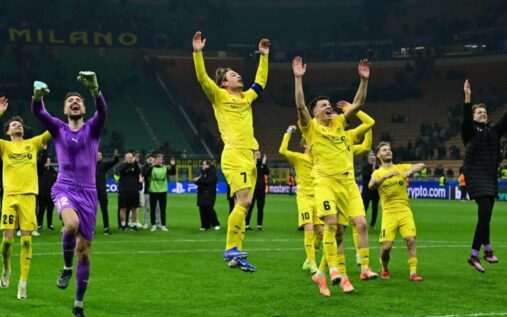 Bodo/Glimt players celebrating a famous Champions League victory on the pitch