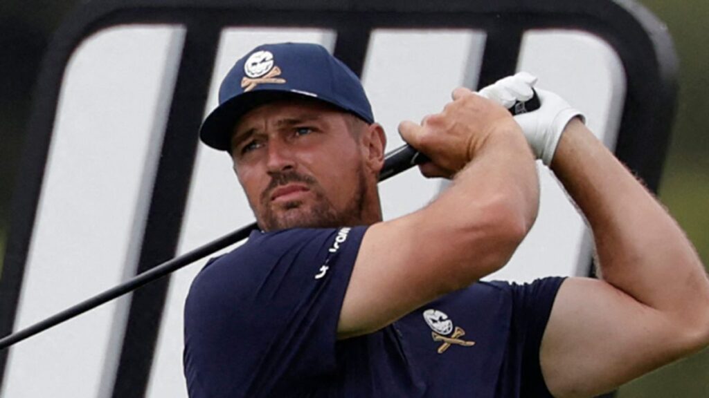 An emotional Bryson DeChambeau lifting the LIV Golf South Africa trophy after defeating Jon Rahm