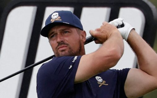 An emotional Bryson DeChambeau lifting the LIV Golf South Africa trophy after defeating Jon Rahm