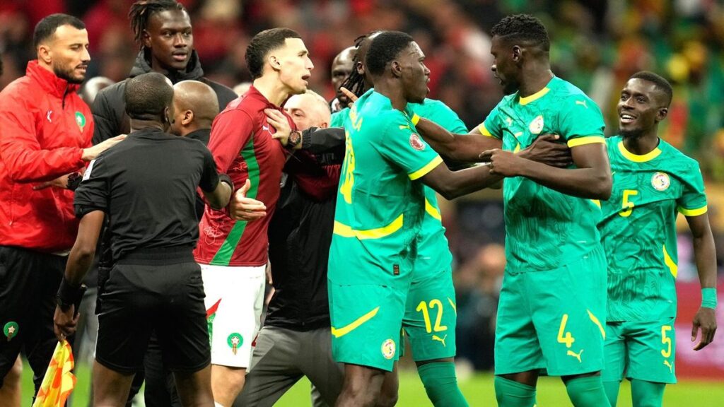 Senegal football players protesting on the pitch during an Africa Cup of Nations match