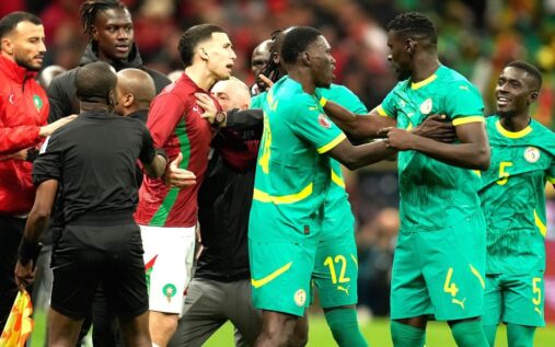 Senegal football players protesting on the pitch during an Africa Cup of Nations match