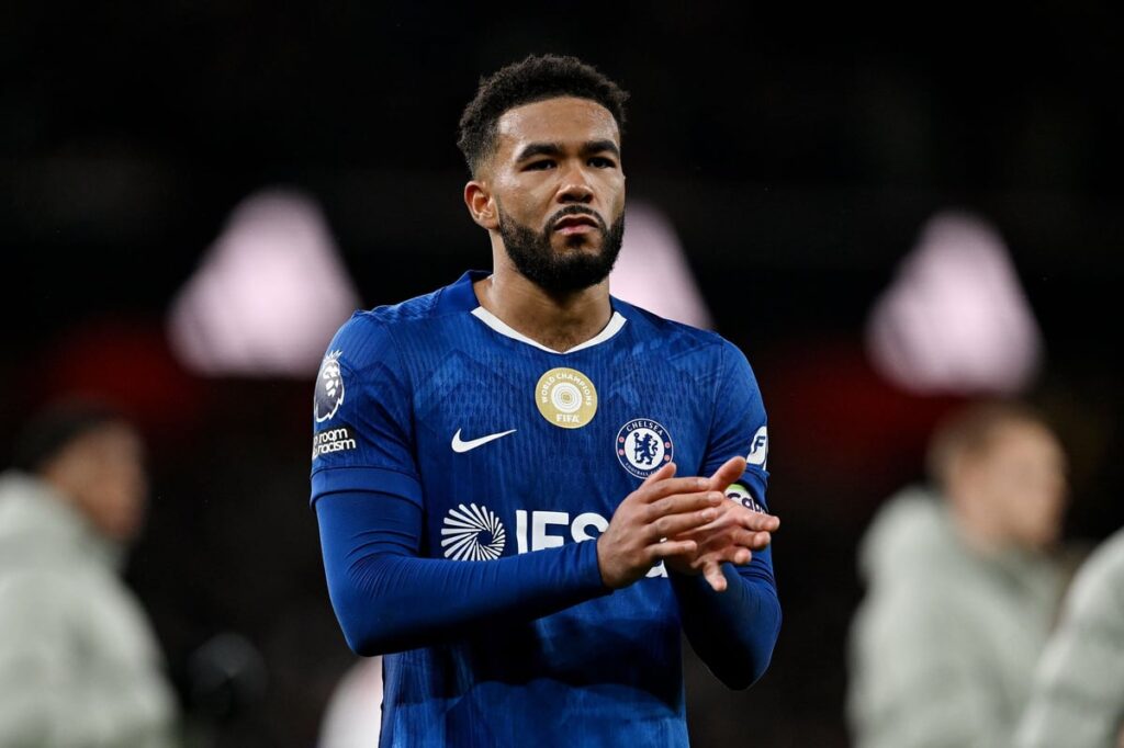 Chelsea defender Reece James walking off the pitch looking disappointed