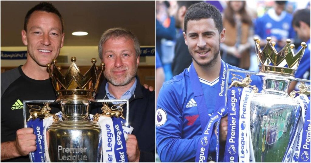 Roman Abramovich holding the Premier League trophy alongside Chelsea players