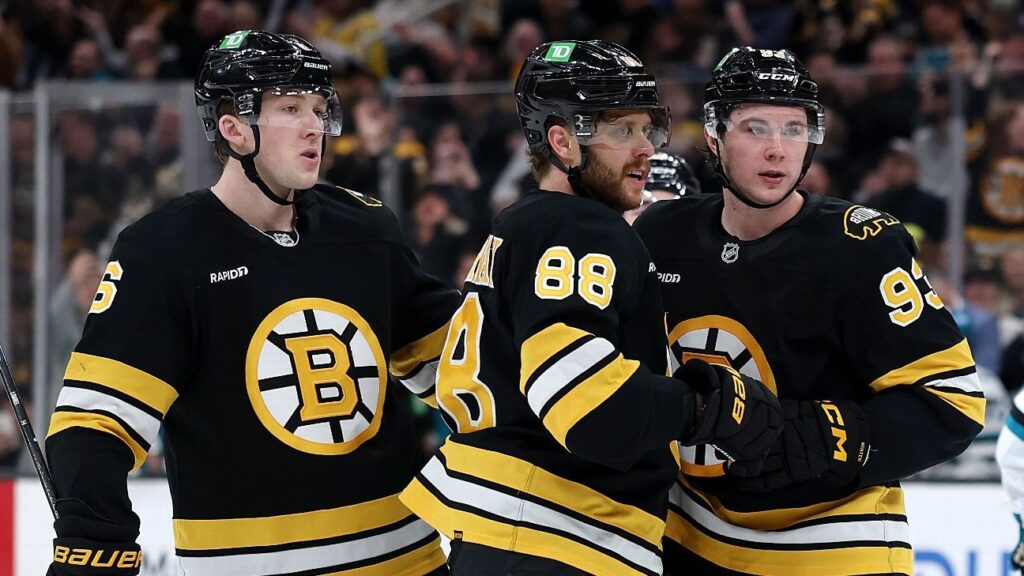 Columbus Blue Jackets hockey players celebrating a goal on the ice during an NHL game