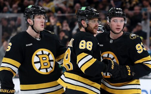 Columbus Blue Jackets hockey players celebrating a goal on the ice during an NHL game