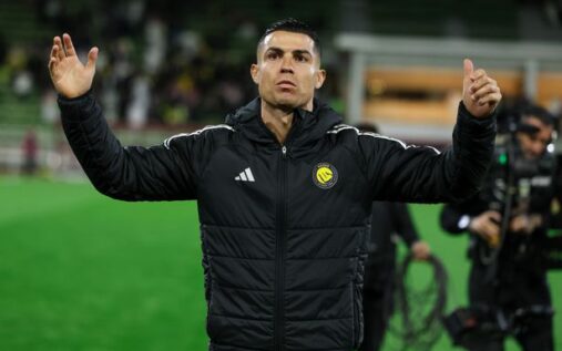 Cristiano Ronaldo walking on the pitch wearing the Portugal national team kit