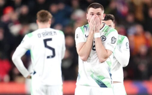 Dejected Republic of Ireland players on the pitch after losing a penalty shootout to the Czech Republic.