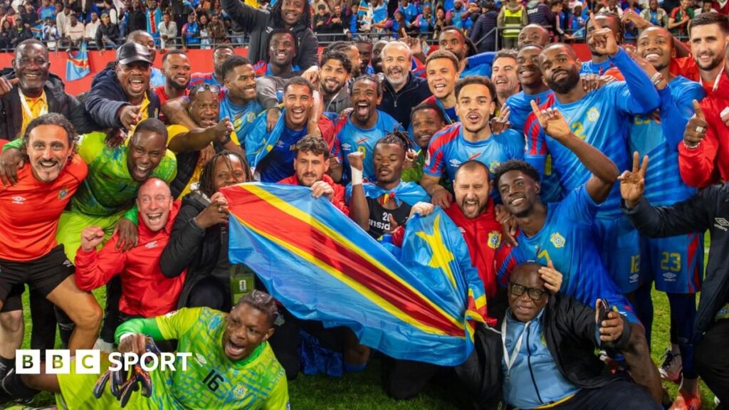 DR Congo national football team players celebrating on the pitch in their blue and red kits
