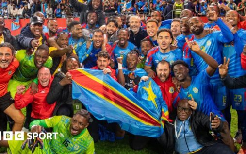 DR Congo national football team players celebrating on the pitch in their blue and red kits