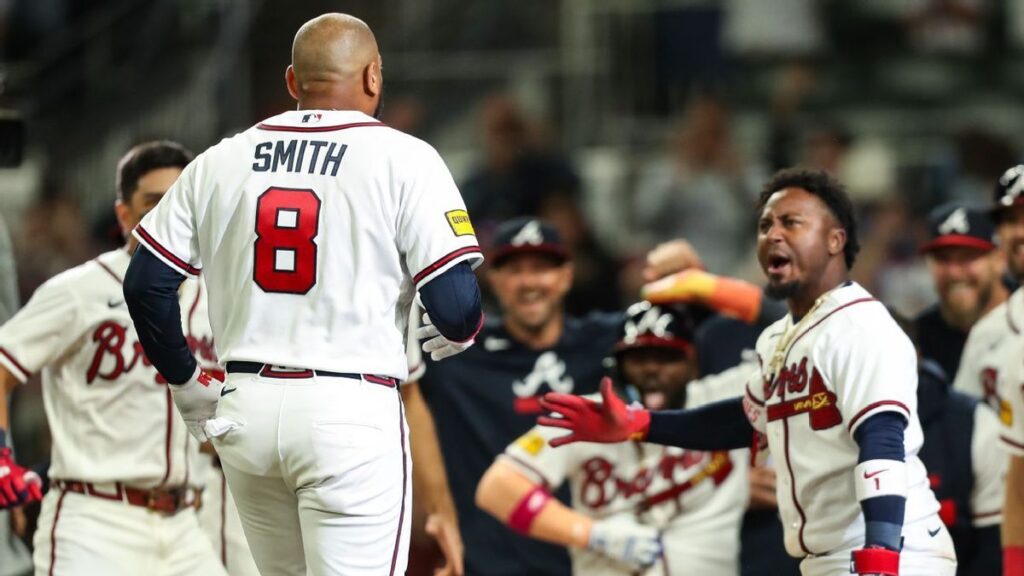 Atlanta Braves batter Dominic Smith celebrating his historic walk-off grand slam