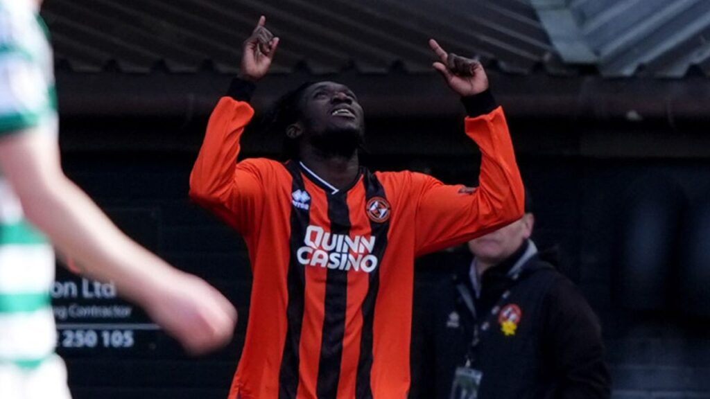 Dundee United players celebrating a goal against Celtic in the Scottish Premiership
