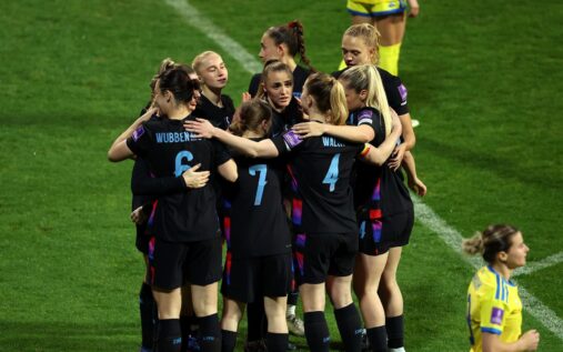England women's players consoling and embracing Ukraine players after their World Cup qualifying match in Turkey.