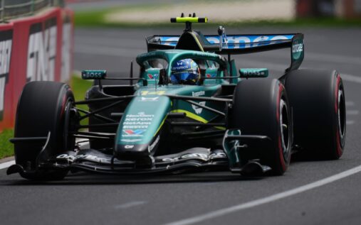 Fernando Alonso driving the Aston Martin Formula 1 car on track