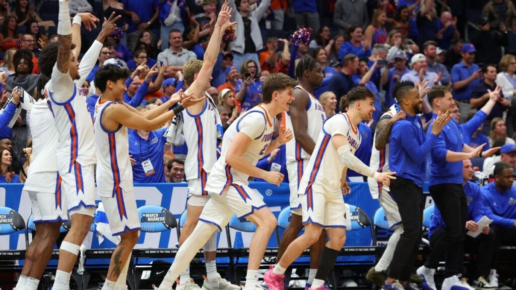Florida Gators basketball players celebrating during their dominant NCAA Tournament victory over Prairie View A&M