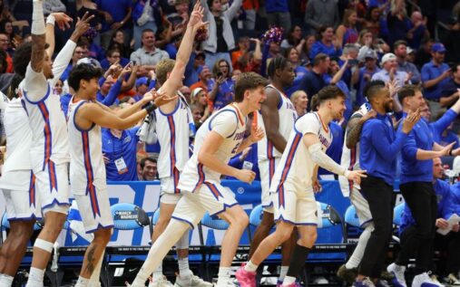 Florida Gators basketball players celebrating during their dominant NCAA Tournament victory over Prairie View A&M