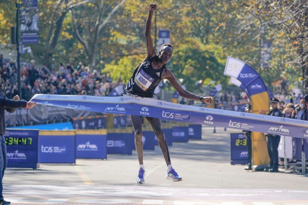 Albert Korir running during a marathon race wearing an athletics vest