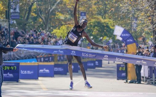 Albert Korir running during a marathon race wearing an athletics vest