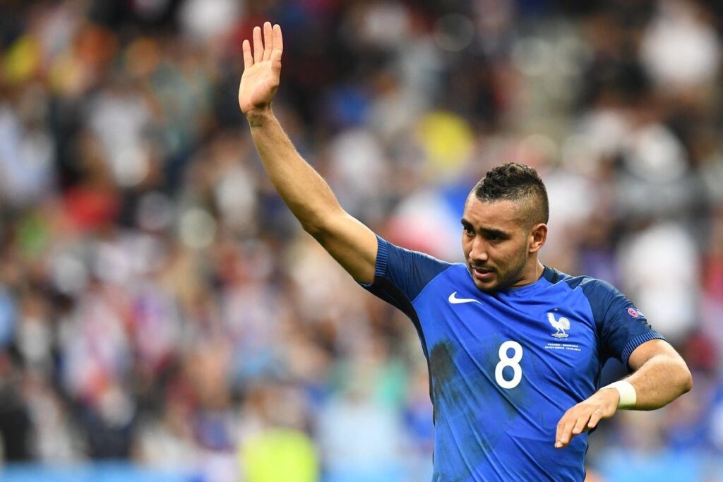 Dimitri Payet waving to the crowd while wearing a Marseille football kit